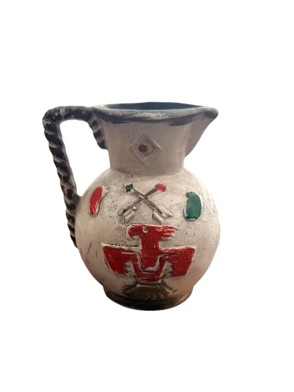 Vintage Kenmar pottery pitcher featuring a prominent red Thunderbird symbol.